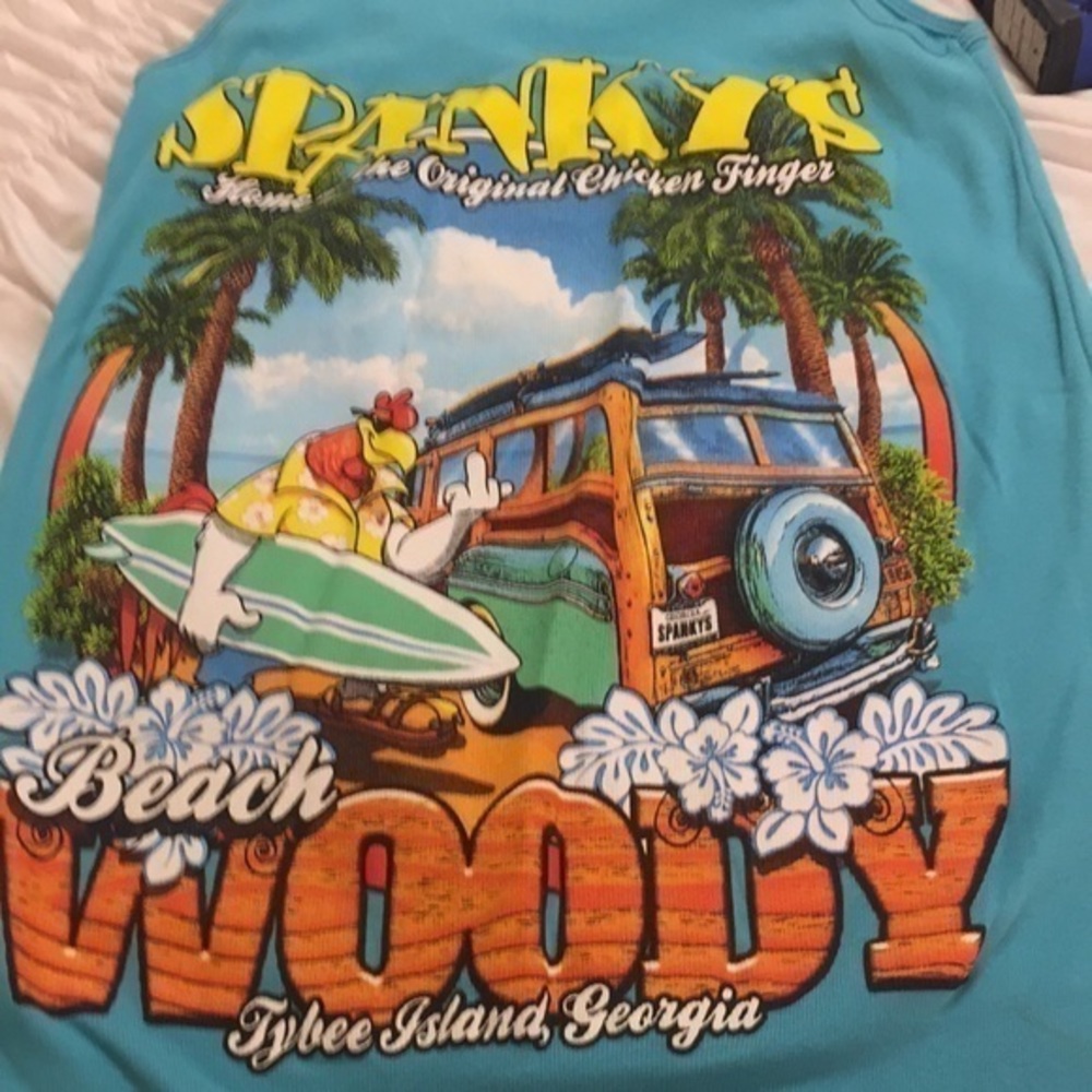 District Spanky’s teal tank top featuring …